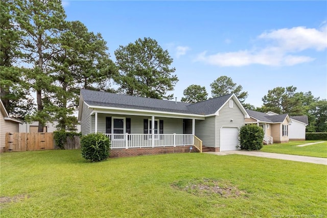 1591 Hazelcrest Dr, Fayetteville, NC 28304 - ranch-style home with a porch, an attached garage, and driveway