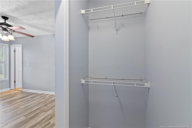 1591 Hazelcrest Dr, Fayetteville, NC 28304 - spacious closet with ceiling fan and wood finished floors