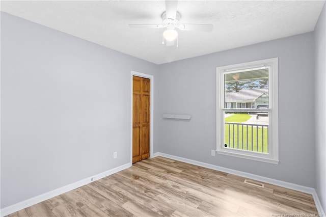 1591 Hazelcrest Dr, Fayetteville, NC 28304 - spare room featuring wood finished floors, ceiling fan, and a textured ceiling