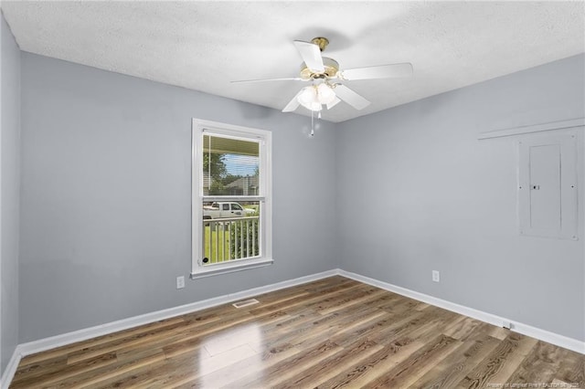1591 Hazelcrest Dr, Fayetteville, NC 28304 - empty room featuring wood finished floors, electric panel, a textured ceiling, and ceiling fan