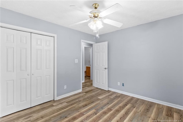 1591 Hazelcrest Dr, Fayetteville, NC 28304 - unfurnished bedroom featuring wood finished floors, a closet, and ceiling fan