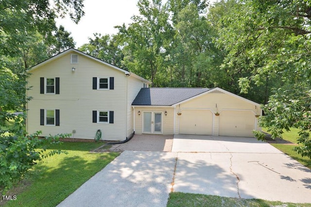 3300 Shaftsbury Drive St, Durham, NC 27704 - traditional home featuring french doors, a front yard, driveway, and an attached garage