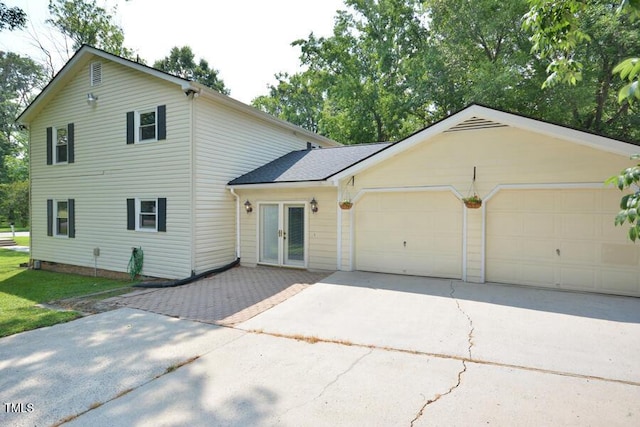 3300 Shaftsbury Drive St, Durham, NC 27704 - view of front of house with french doors, driveway, and an attached garage