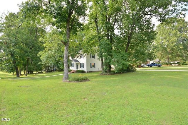 3300 Shaftsbury Drive St, Durham, NC 27704 - view of green lawn with view of wooded area