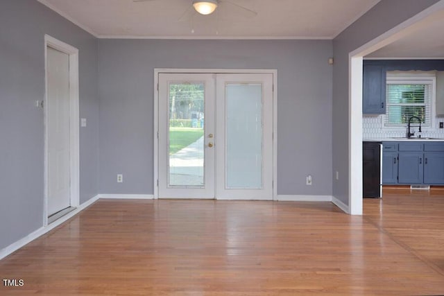 3300 Shaftsbury Drive St, Durham, NC 27704 - empty room with a ceiling fan, light wood-style flooring, and ornamental molding