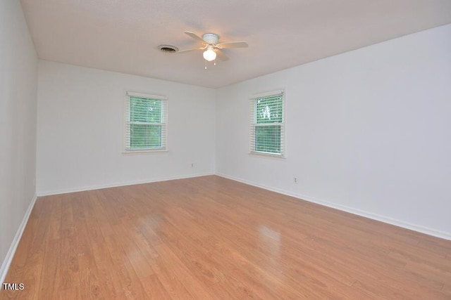 3300 Shaftsbury Drive St, Durham, NC 27704 - empty room with healthy amount of natural light, light wood finished floors, and a ceiling fan