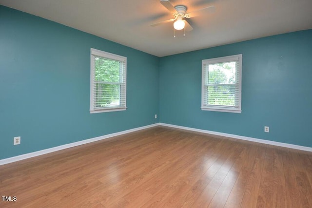 3300 Shaftsbury Drive St, Durham, NC 27704 - empty room featuring healthy amount of natural light, ceiling fan, and wood finished floors