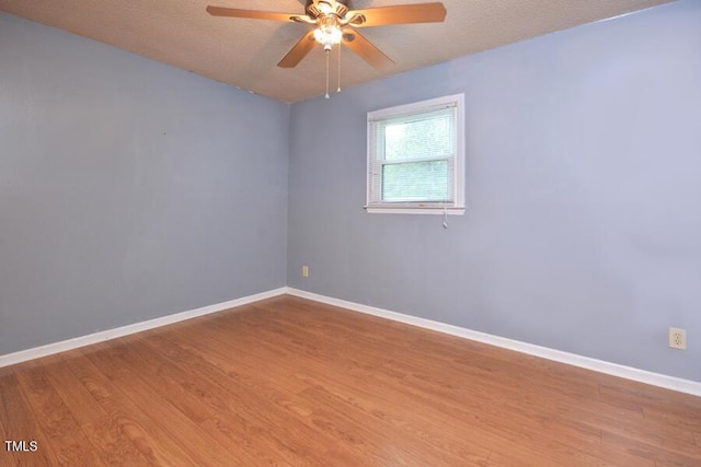 3300 Shaftsbury Drive St, Durham, NC 27704 - spare room featuring wood finished floors, a ceiling fan, and a textured ceiling