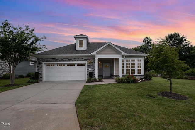 1164 Hudson Dr, Mebane, NC 27302 - view of front of house featuring stone siding, a yard, driveway, an attached garage, and roof with shingles
