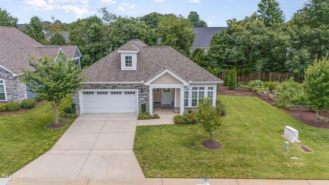 1164 Hudson Dr, Mebane, NC 27302 - view of front facade featuring stone siding, concrete driveway, a garage, and a shingled roof