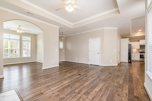 1164 Hudson Dr, Mebane, NC 27302 - unfurnished living room with a ceiling fan, healthy amount of natural light, dark wood-style flooring, and arched walkways