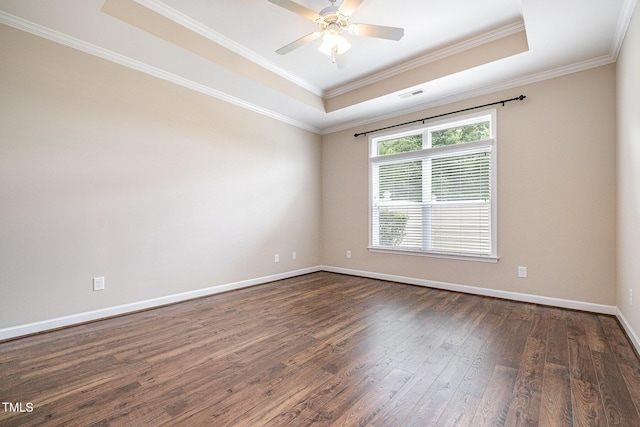 1164 Hudson Dr, Mebane, NC 27302 - unfurnished room with a tray ceiling, dark wood-style floors, crown molding, and a ceiling fan