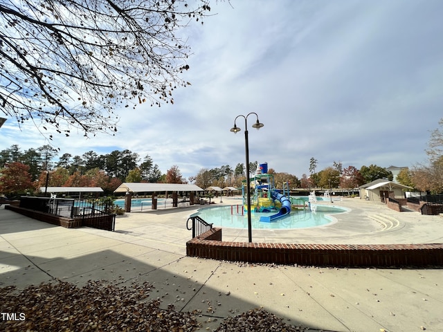 1742 Whirlaway Ct, Cary, NC 27519 - community pool with a water play area, a patio, and a water slide