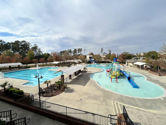 1742 Whirlaway Ct, Cary, NC 27519 - community pool with a water play area, a water slide, and a patio area