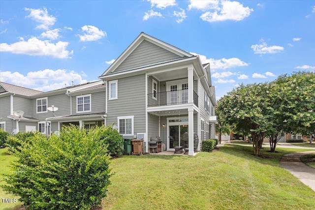 1742 Whirlaway Ct, Cary, NC 27519 - rear view of house featuring a balcony and a yard