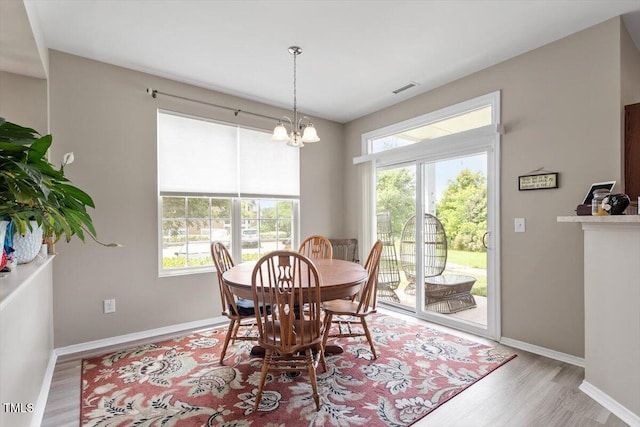 1742 Whirlaway Ct, Cary, NC 27519 - dining room featuring wood finished floors and a chandelier