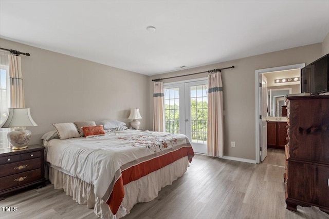 1742 Whirlaway Ct, Cary, NC 27519 - bedroom with access to outside, light wood-type flooring, french doors, and ensuite bathroom