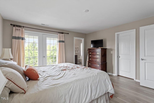 1742 Whirlaway Ct, Cary, NC 27519 - bedroom with access to outside, wood finished floors, french doors, and connected bathroom