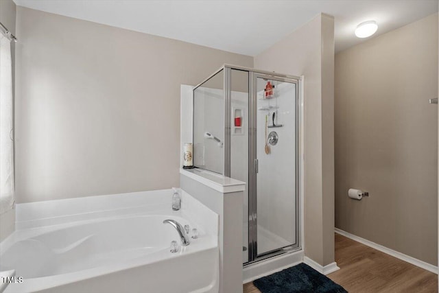 1742 Whirlaway Ct, Cary, NC 27519 - full bathroom with a stall shower, a bath, and wood finished floors