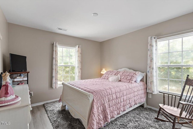 1742 Whirlaway Ct, Cary, NC 27519 - bedroom with baseboards and wood finished floors