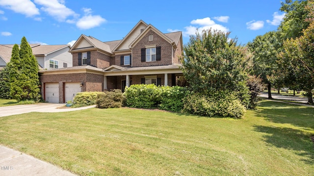 1019 Falkirk Dr, Burlington, NC 27215 - view of front of house featuring driveway, a front yard, and brick siding