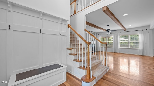 1019 Falkirk Dr, Burlington, NC 27215 - staircase with a ceiling fan, wood finished floors, beamed ceiling, a decorative wall, and recessed lighting