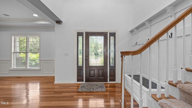 1019 Falkirk Dr, Burlington, NC 27215 - entrance foyer with stairway, wood-type flooring, a decorative wall, a wainscoted wall, and recessed lighting