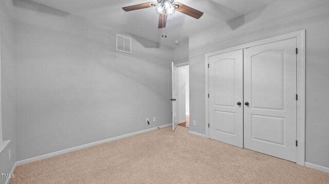 1019 Falkirk Dr, Burlington, NC 27215 - unfurnished bedroom with light colored carpet, a closet, and ceiling fan