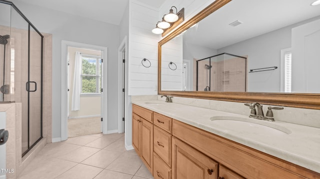 1019 Falkirk Dr, Burlington, NC 27215 - bathroom featuring tile patterned flooring, double vanity, and a stall shower