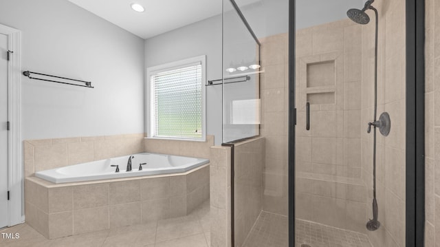 1019 Falkirk Dr, Burlington, NC 27215 - full bath featuring a stall shower, a garden tub, and tile patterned flooring
