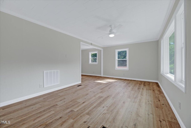 1109 Magnolia Dr, Durham, NC 27707 - spare room featuring plenty of natural light, ornamental molding, wood finished floors, and a ceiling fan