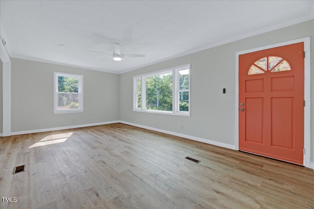 1109 Magnolia Dr, Durham, NC 27707 - foyer featuring crown molding, a ceiling fan, plenty of natural light, and wood finished floors