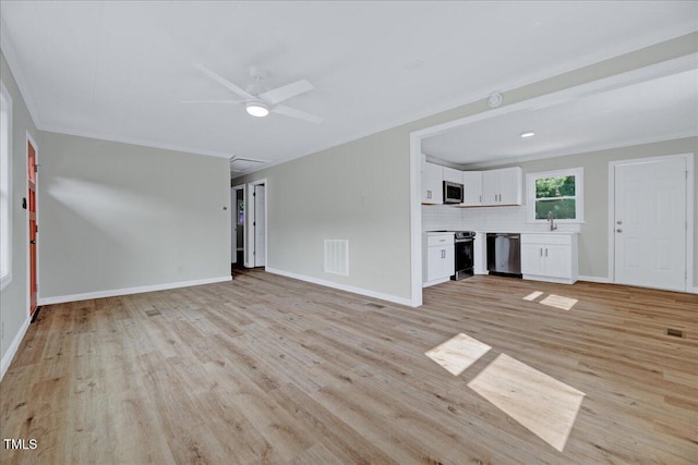 1109 Magnolia Dr, Durham, NC 27707 - unfurnished living room featuring light wood finished floors, ceiling fan, and crown molding