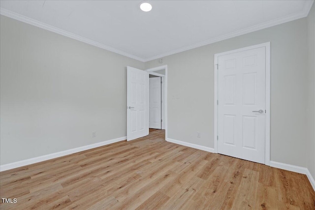 1109 Magnolia Dr, Durham, NC 27707 - unfurnished bedroom with wood finished floors and ornamental molding