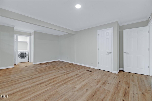 1109 Magnolia Dr, Durham, NC 27707 - below grade area with washer / dryer, wood finished floors, and crown molding