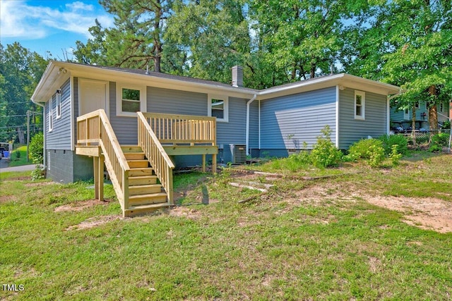 1109 Magnolia Dr, Durham, NC 27707 - back of property with crawl space, a wooden deck, and stairs