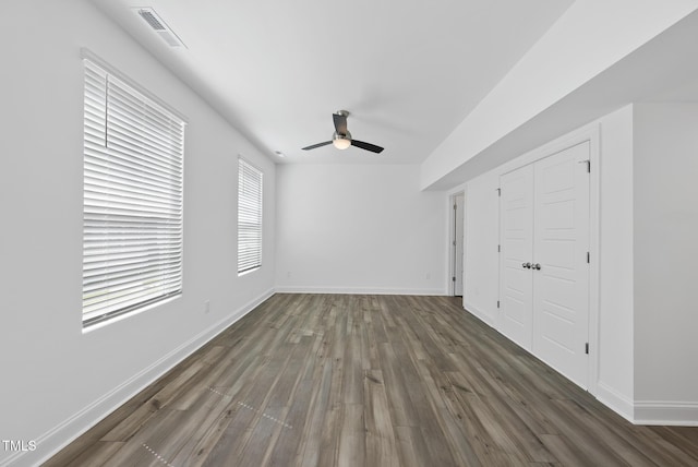 506 Village Branch Ln, Wake Forest, NC 27587 - unfurnished bedroom with wood finished floors, a closet, and a ceiling fan