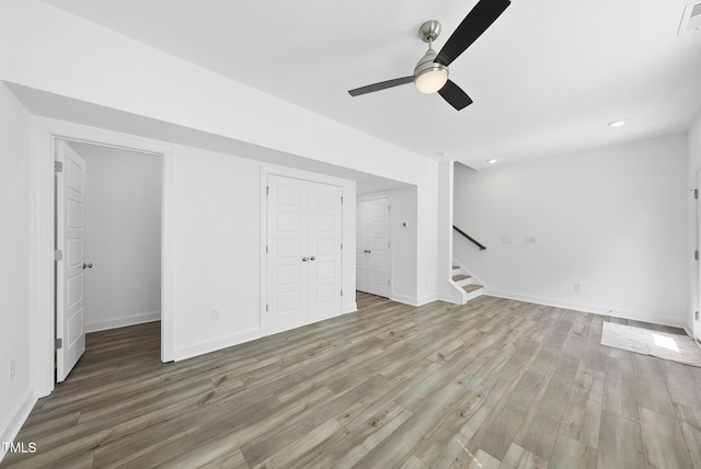 506 Village Branch Ln, Wake Forest, NC 27587 - unfurnished living room with ceiling fan, stairs, wood finished floors, and recessed lighting