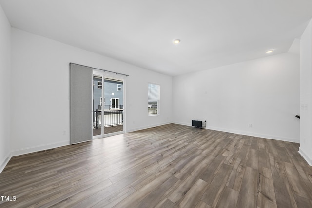 506 Village Branch Ln, Wake Forest, NC 27587 - unfurnished room featuring wood finished floors and recessed lighting
