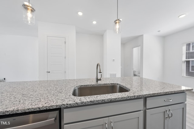 506 Village Branch Ln, Wake Forest, NC 27587 - kitchen with gray cabinetry, dishwasher, light stone countertops, pendant lighting, and recessed lighting