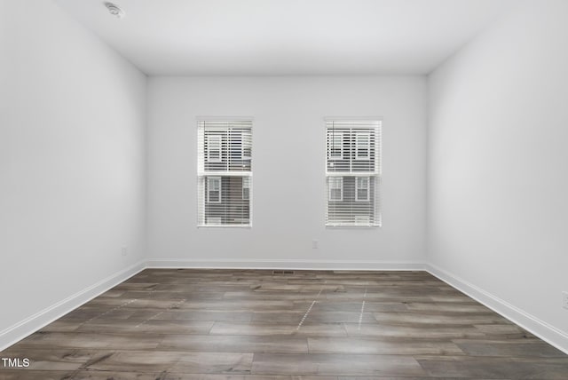 506 Village Branch Ln, Wake Forest, NC 27587 - spare room featuring wood finished floors and a smoke detector