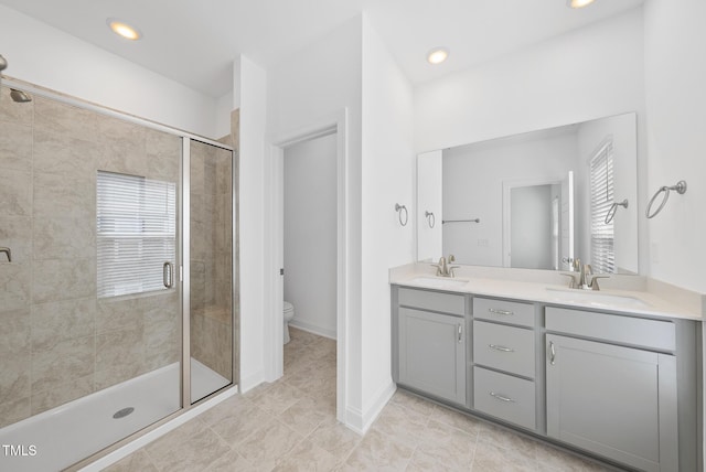 506 Village Branch Ln, Wake Forest, NC 27587 - bathroom with double vanity, a stall shower, tile patterned flooring, and recessed lighting