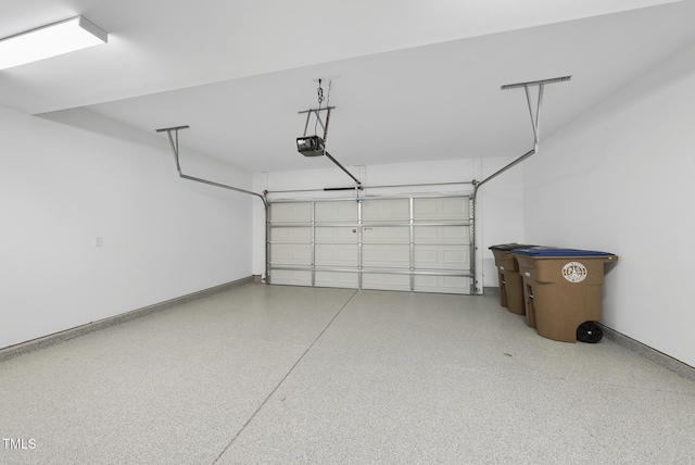 506 Village Branch Ln, Wake Forest, NC 27587 - garage with baseboards and a garage door opener