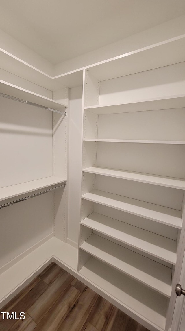 506 Village Branch Ln, Wake Forest, NC 27587 - walk in closet with dark wood-type flooring