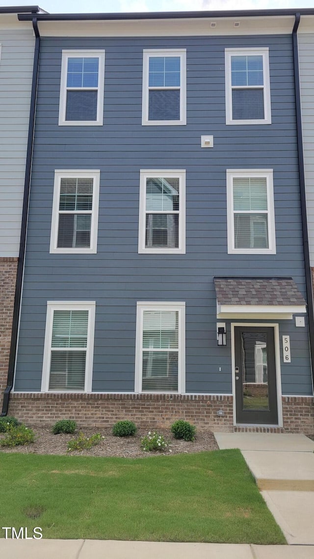 506 Village Branch Ln, Wake Forest, NC 27587 - view of front of home with brick siding and a front lawn