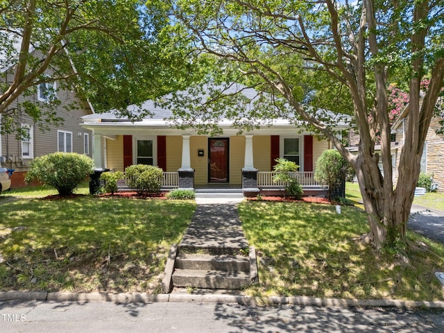 1309 Watts St, Durham, NC 27701 - view of front of property with covered porch and a front lawn