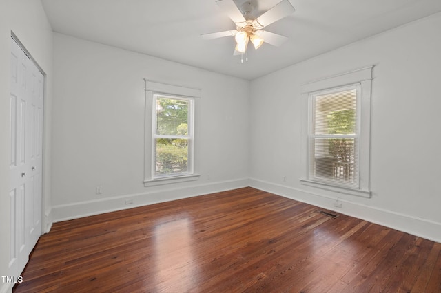 1309 Watts St, Durham, NC 27701 - unfurnished bedroom featuring hardwood / wood-style flooring, a closet, and a ceiling fan