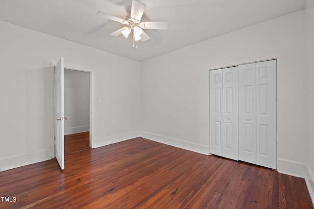 1309 Watts St, Durham, NC 27701 - unfurnished bedroom with a closet, dark wood finished floors, and ceiling fan