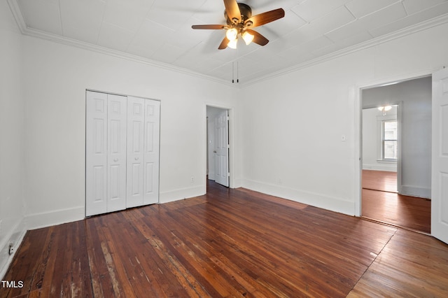 1309 Watts St, Durham, NC 27701 - unfurnished bedroom with ornamental molding, wood-type flooring, a closet, and a ceiling fan