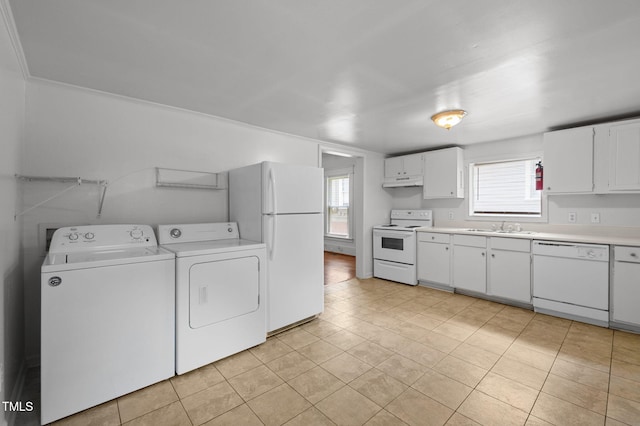 1309 Watts St, Durham, NC 27701 - kitchen featuring washing machine and clothes dryer, light countertops, white appliances, and white cabinets